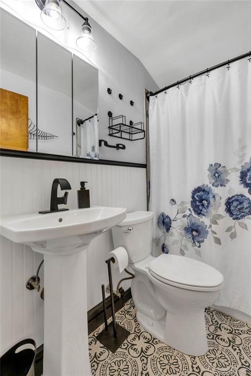 208 Gass Road Pittsburgh, PA 15229 - Photo 19 of 22 a bathroom with a sink toilet a mirror and shower