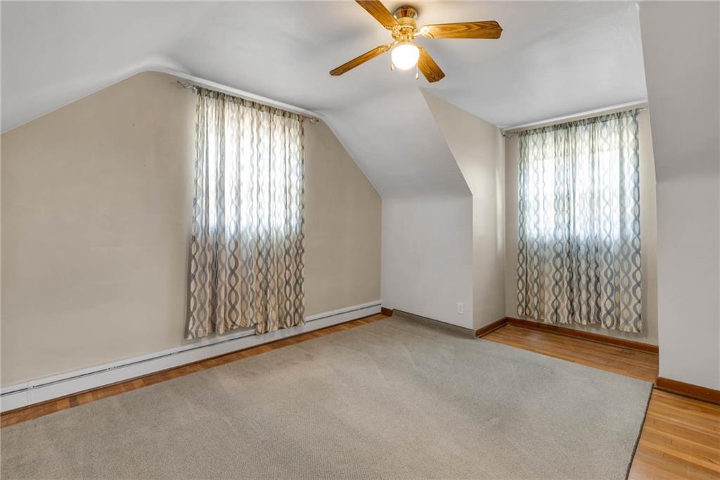 208 Gass Road Pittsburgh, PA 15229 - Photo 20 of 22 an empty room with windows and fan