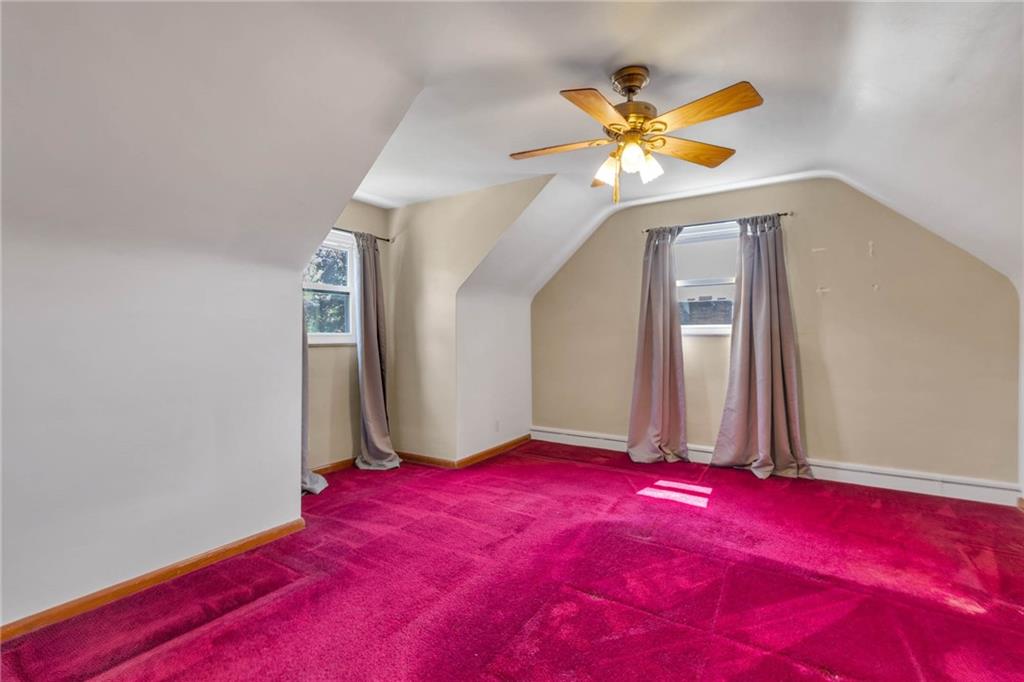 208 Gass Road Pittsburgh, PA 15229 - Photo 21 of 22 a bedroom with a bed and a chandelier