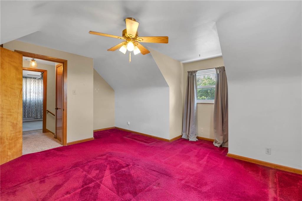 208 Gass Road Pittsburgh, PA 15229 - Photo 22 of 22 a bedroom with a bed and a chandelier