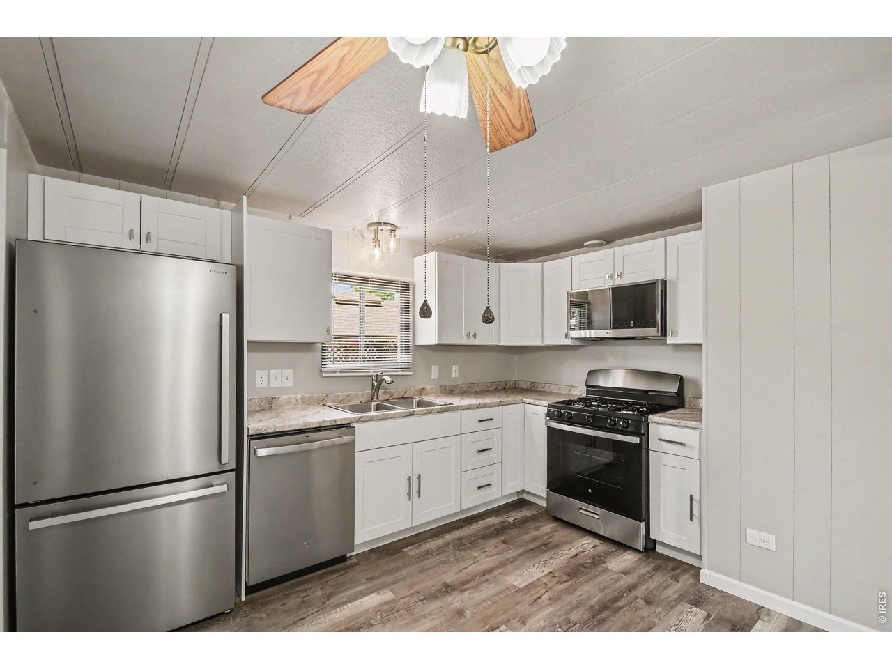 8317 6th Street Wellington, CO 80549 - Photo 9 of 21 Ample cabinet and counter space