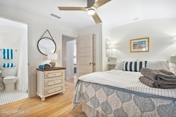 a bedroom with a bed and a dresser