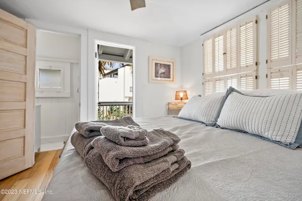 a bedroom with a bed and a couch