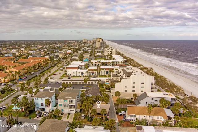 an aerial view of residential building and parking space
