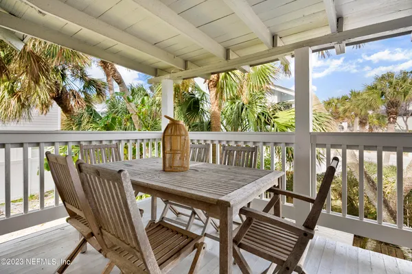 a view of a balcony with furniture