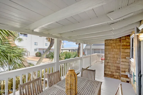 a view of balcony with furniture