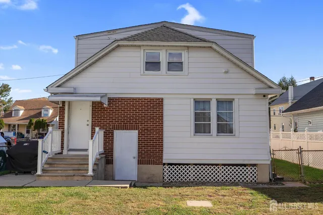 a front view of a house with glass windows