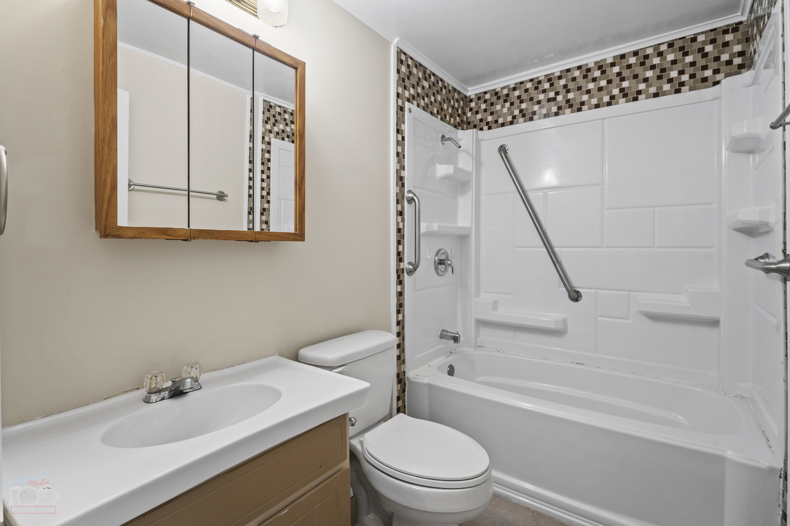 63 South 3120W Road Kankakee, IL 60901 - Photo 13 of 24 a bathroom with a sink a toilet and shower