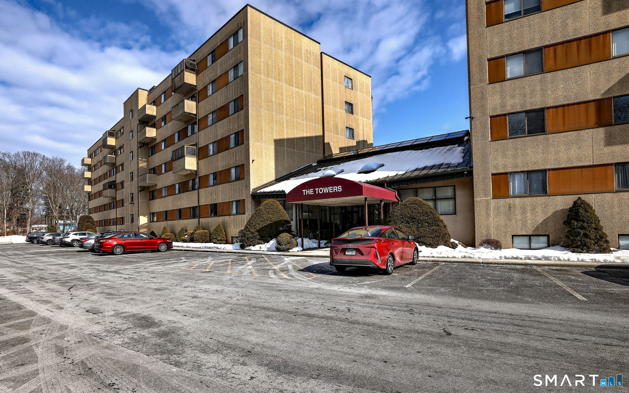 70 Putter Drive, Unit 211 Wallingford, CT 06492 - Photo 2 of 40 a car parked in front of a building