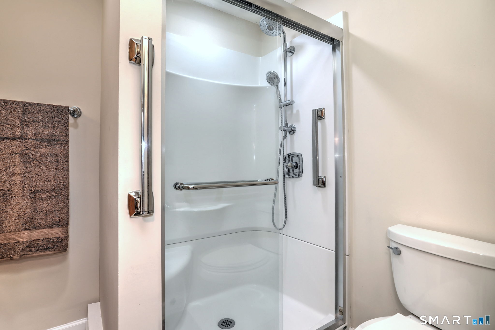 70 Putter Drive, Unit 211 Wallingford, CT 06492 - Photo 21 of 40 a bathroom with a toilet and a shower