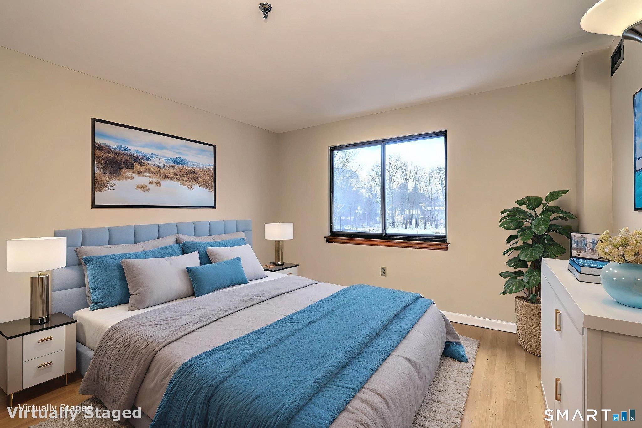 70 Putter Drive, Unit 211 Wallingford, CT 06492 - Photo 24 of 40 a bedroom with bed and a window