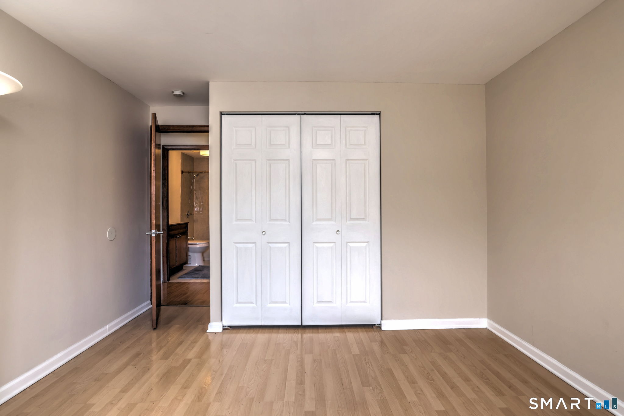 70 Putter Drive, Unit 211 Wallingford, CT 06492 - Photo 35 of 40 a view of an empty room with closet and a window