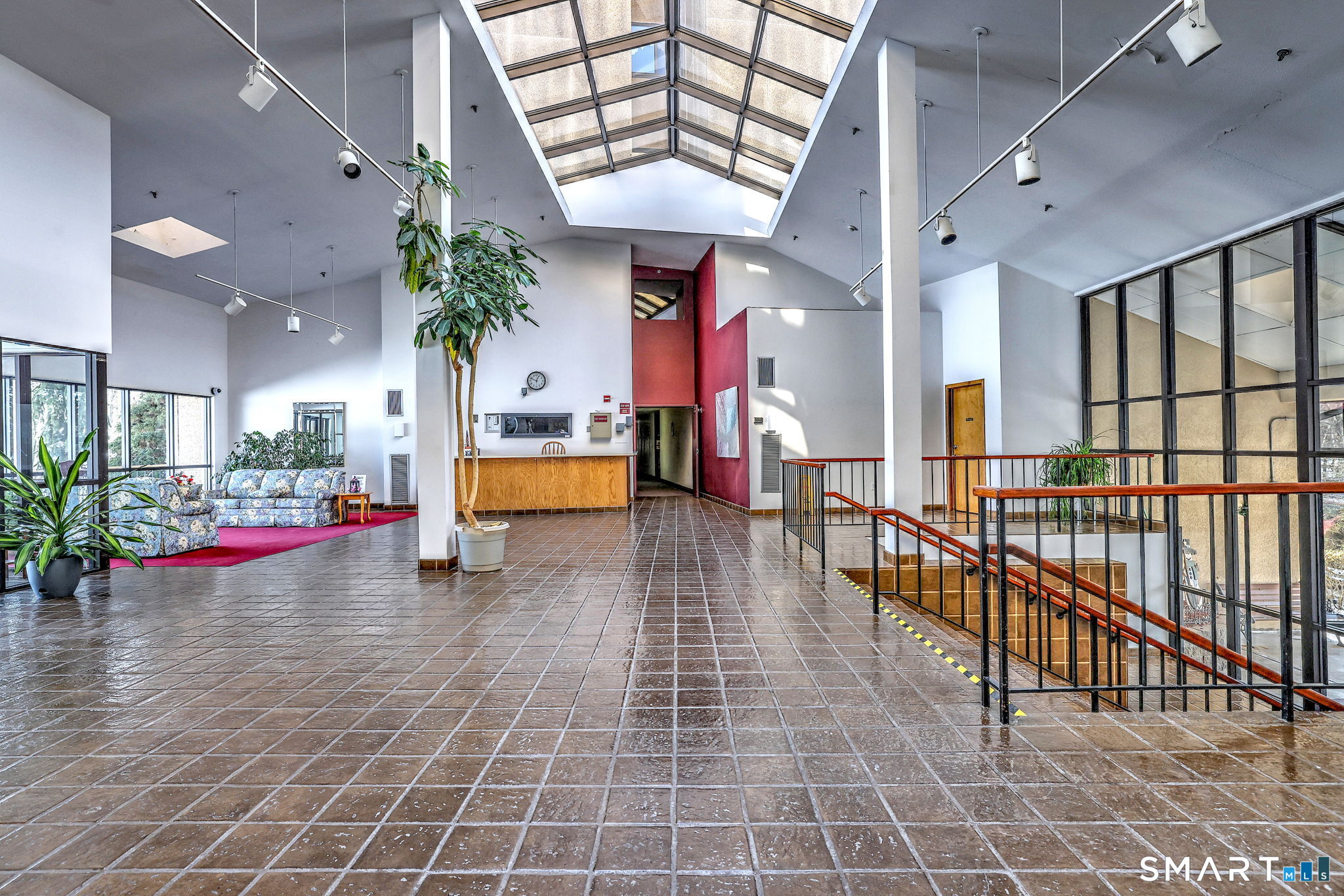 70 Putter Drive, Unit 211 Wallingford, CT 06492 - Photo 39 of 40 an entryway in a hall with a large windows