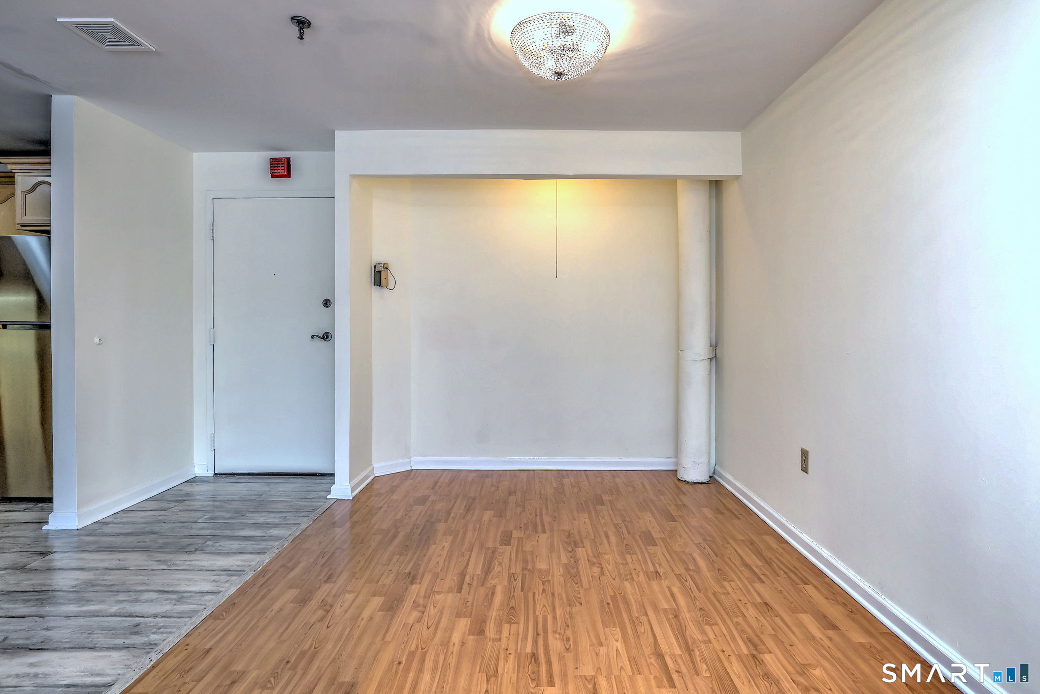 70 Putter Drive, Unit 211 Wallingford, CT 06492 - Photo 9 of 40 a view of a room with wooden floor