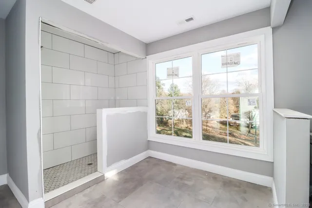 a view of an empty room with a window