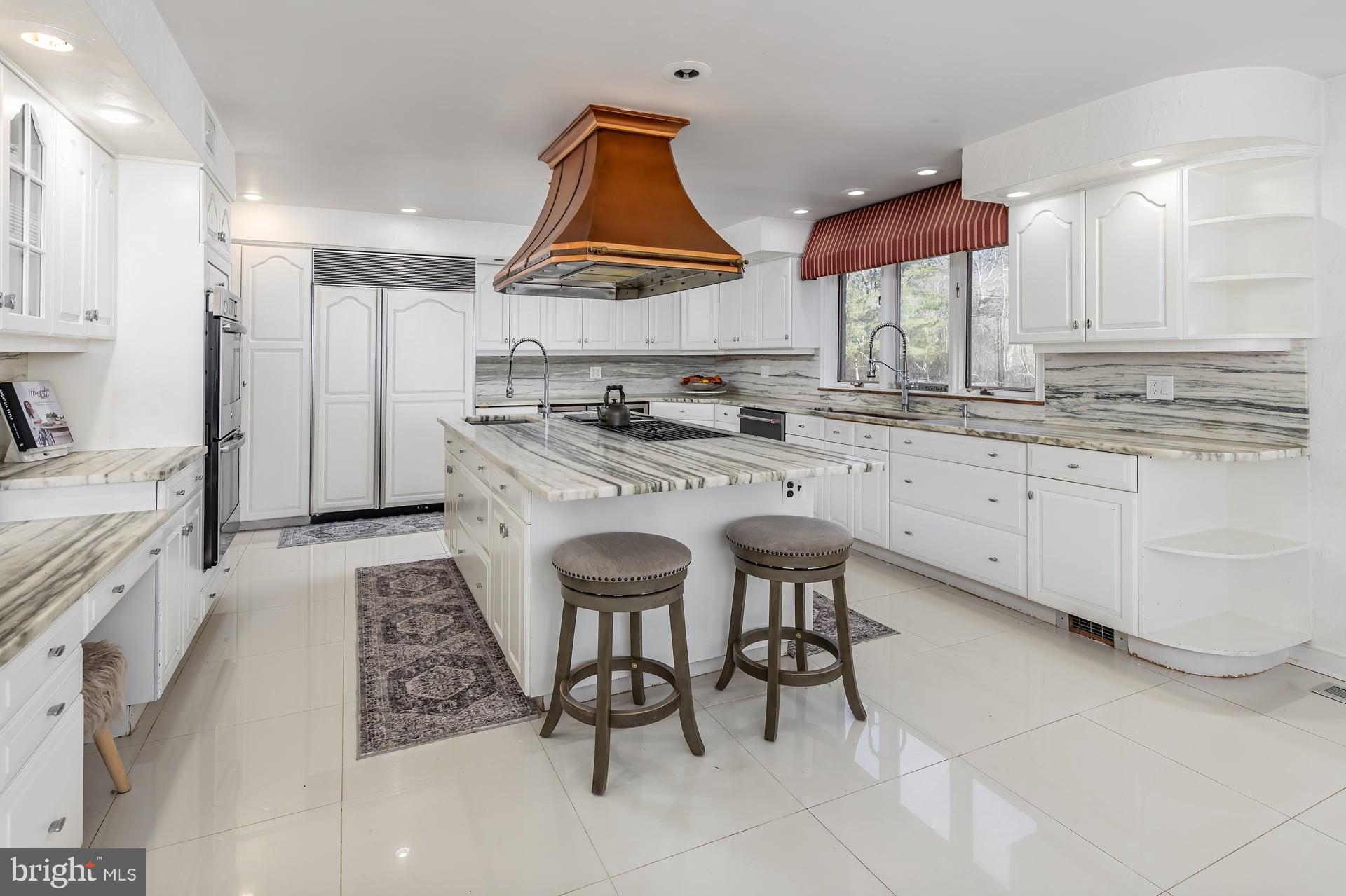 1322 Commissioners Road Mullica Hill, NJ 08062 - Photo 11 of 31 a kitchen with stainless steel appliances granite countertop a stove a sink and a refrigerator