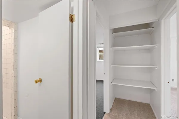 a bathroom with a bathtub shower sink vanity and toilet