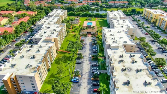 a front view of house with yard and swimming pool