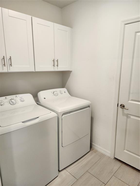 12537 Timber Moss Lane Riverview, FL 33579 - Photo 13 of 16 a utility room with dryer and washer
