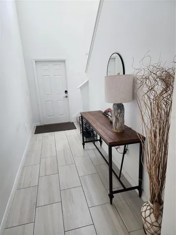 a view of a room with a large window