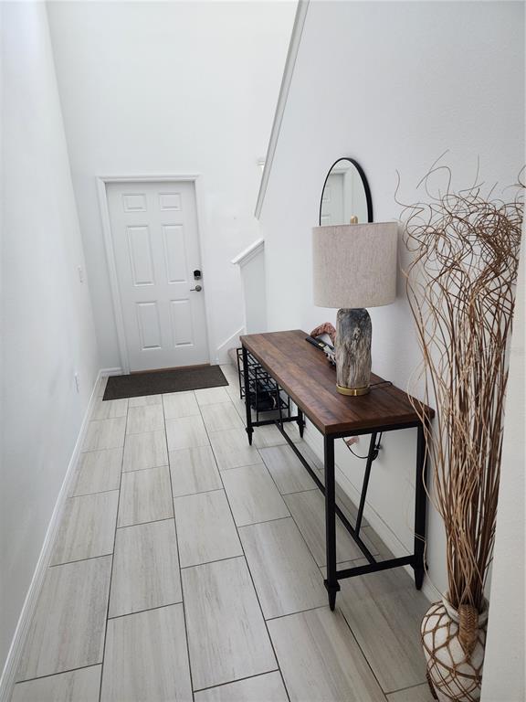 12537 Timber Moss Lane Riverview, FL 33579 - Photo 4 of 16 a view of a workspace with furniture and wooden floor