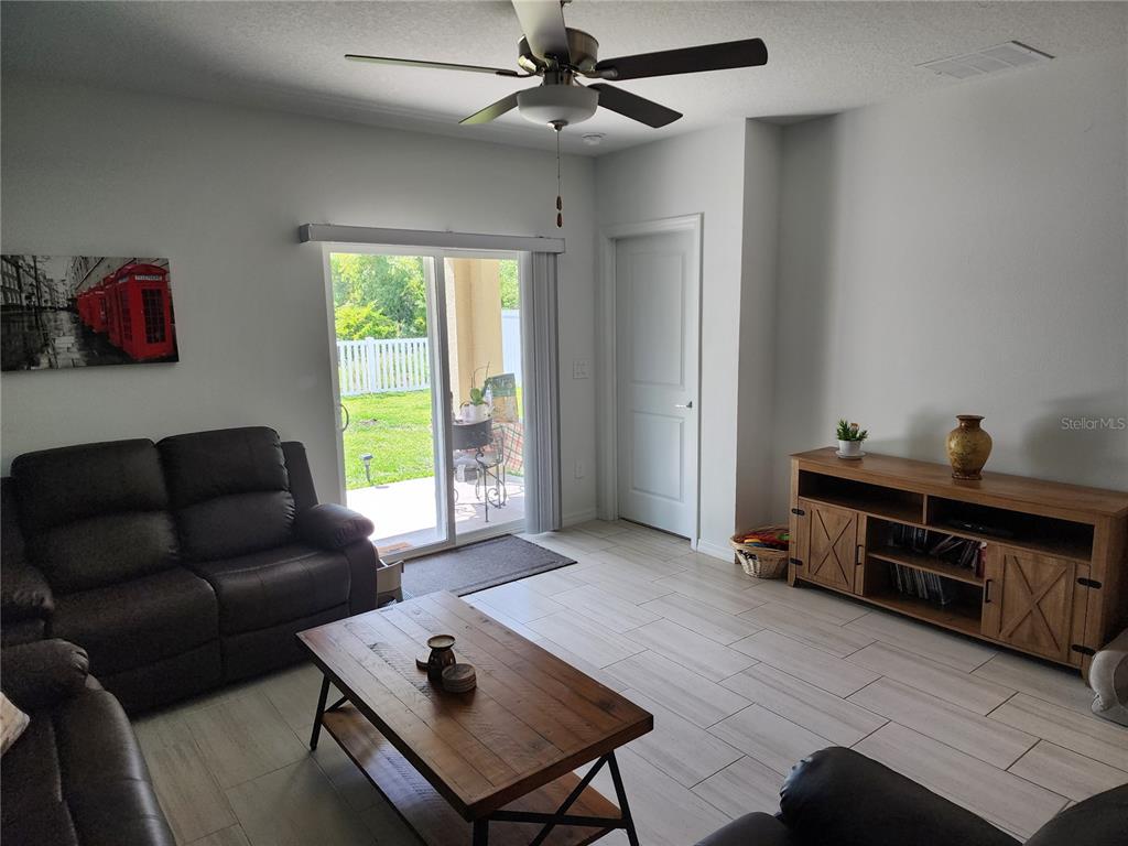 12537 Timber Moss Lane Riverview, FL 33579 - Photo 10 of 16 a living room with furniture and a window