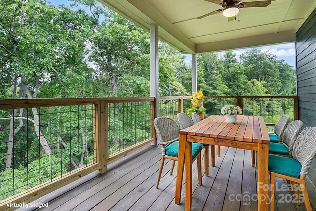 a view of balcony with furniture and wooden deck