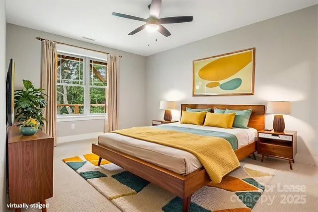 a bedroom with a bed and painting on the wall