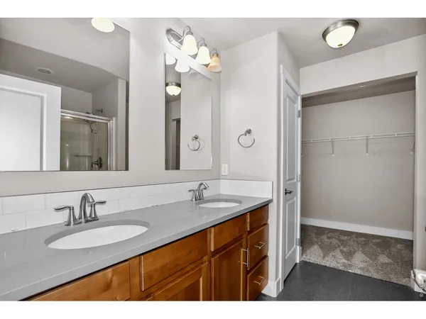 a bathroom with a glass shower door