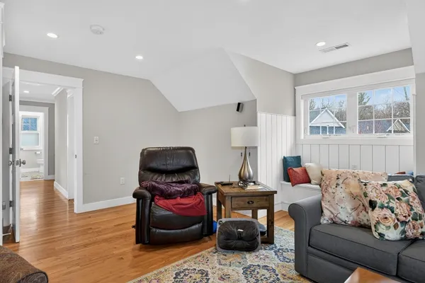 a bedroom with furniture and a window