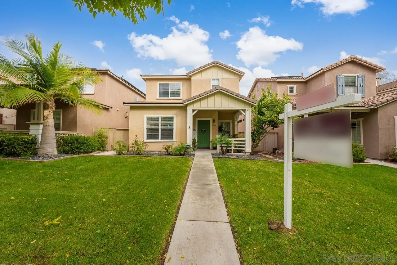1322 Mill Valley Road Chula Vista, CA 91913 - Photo 1 of 25 a front view of a house with a yard and potted plants