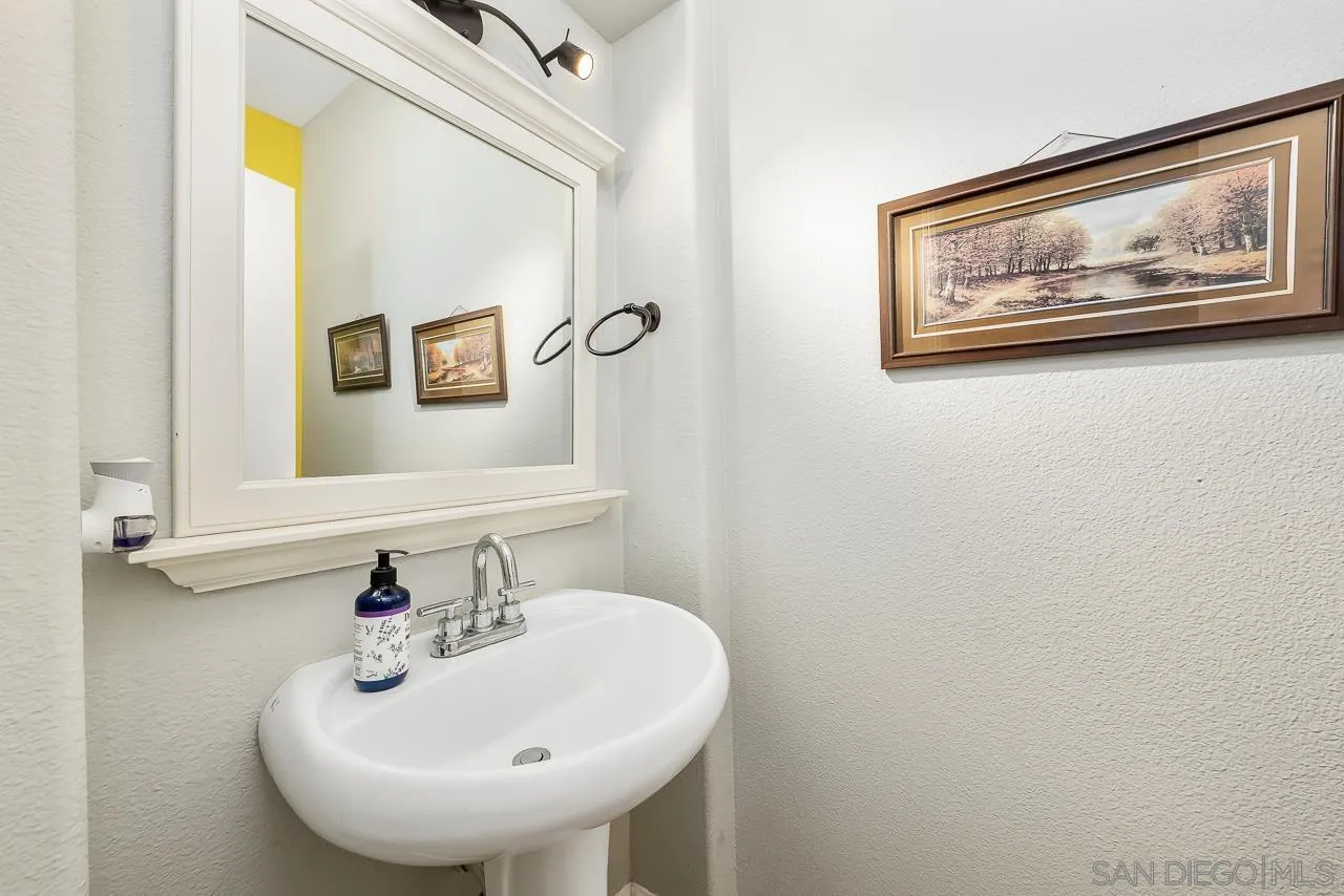 1322 Mill Valley Road Chula Vista, CA 91913 - Photo 12 of 25 a bathroom with a sink and a mirror
