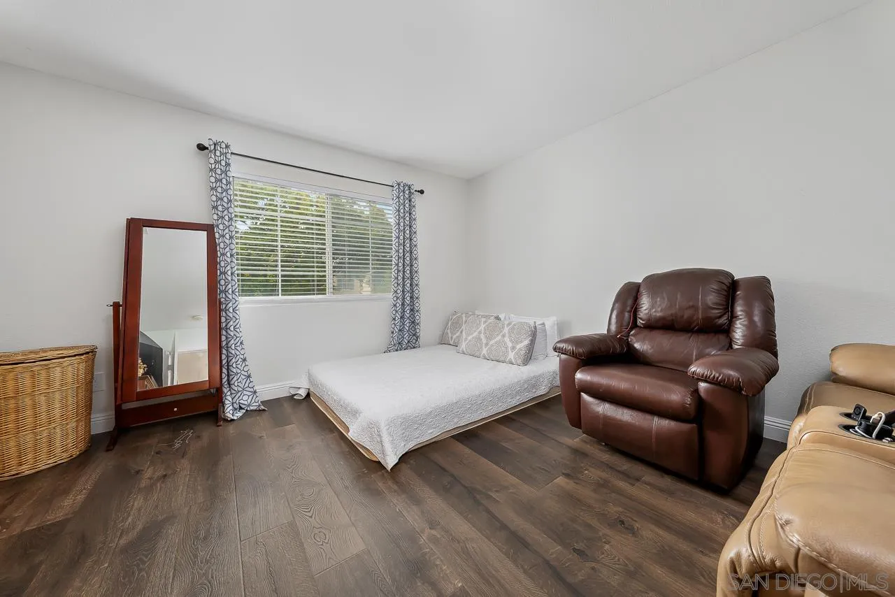 1322 Mill Valley Road Chula Vista, CA 91913 - Photo 13 of 25 a bedroom with a bed and a couch next to a window