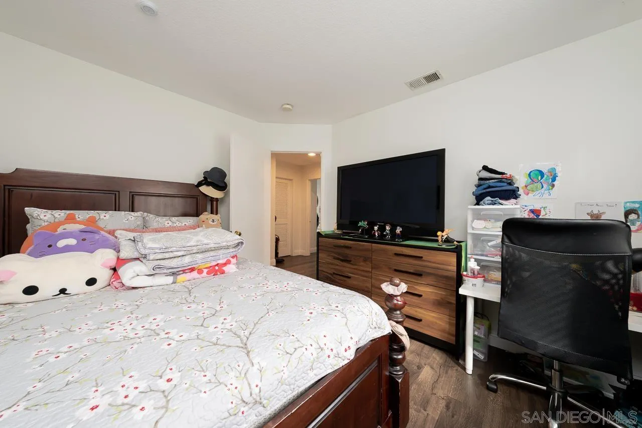 1322 Mill Valley Road Chula Vista, CA 91913 - Photo 19 of 25 a bedroom with a bed and flat tv screen on the dresser