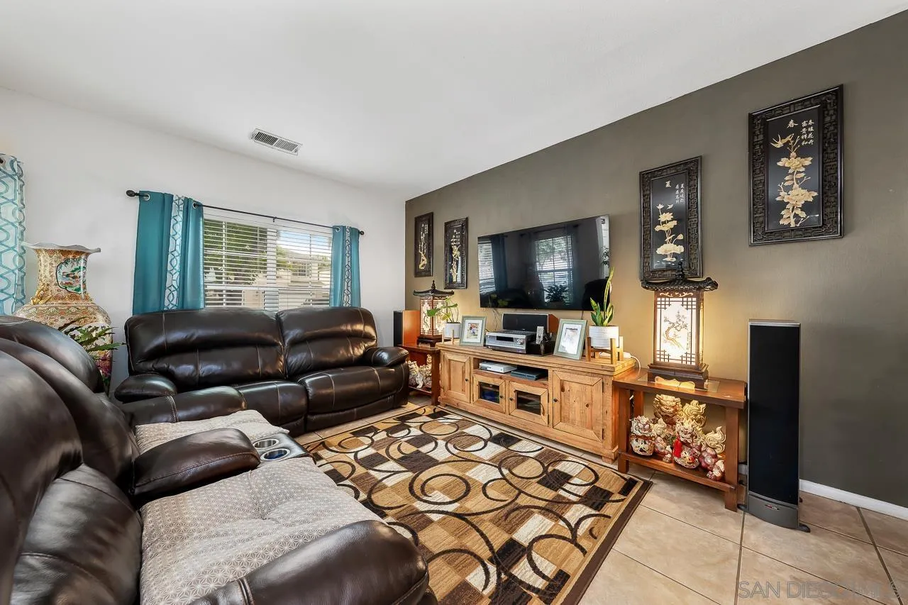 1322 Mill Valley Road Chula Vista, CA 91913 - Photo 4 of 25 a living room with furniture and a flat screen tv