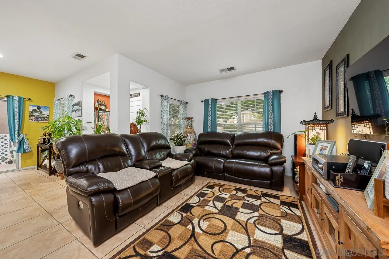 1322 Mill Valley Road Chula Vista, CA 91913 - Photo 5 of 25 a living room with furniture and a flat screen tv