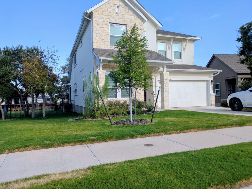 a front view of a house with garden