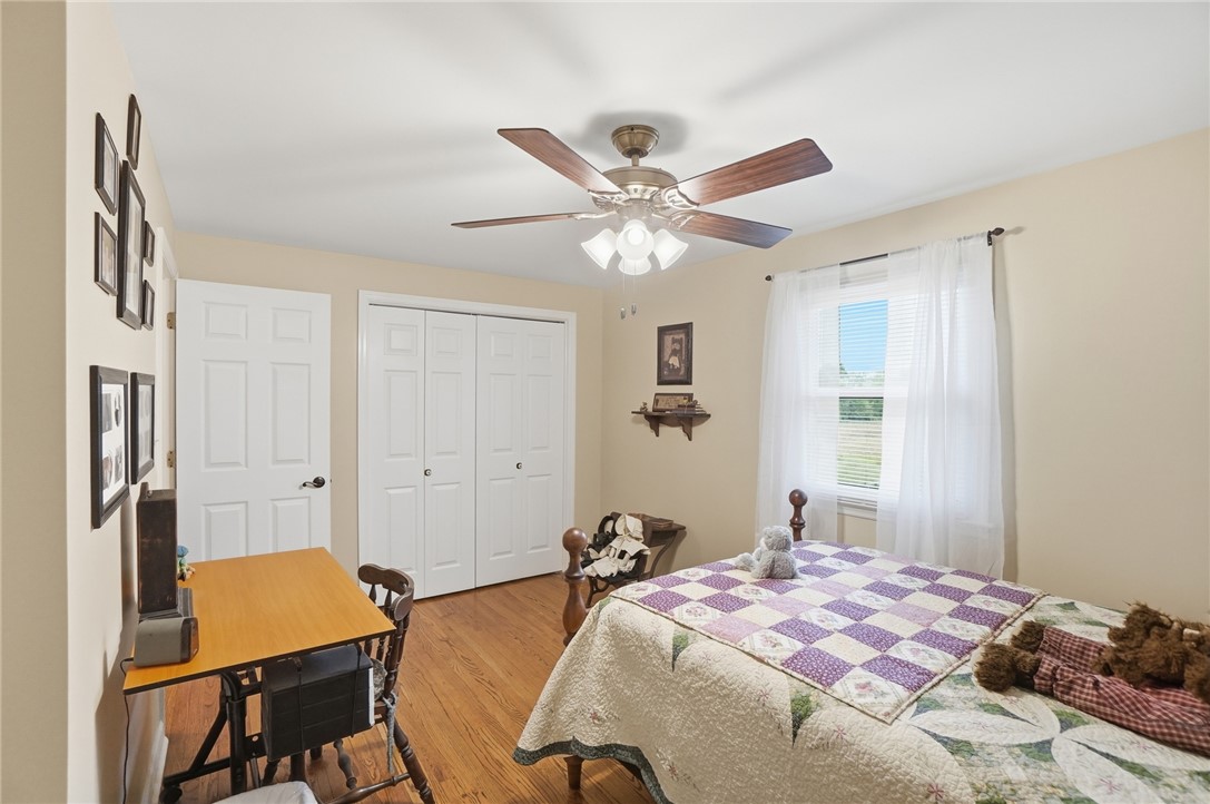 4170 Johnson Road Springfield, OH 45502 - Photo 45 of 54 Hardwood floors and a bright window elevate this comfortable bedroom space.