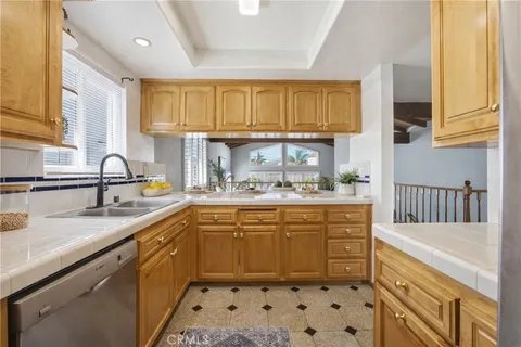 a kitchen with sink cabinets and window