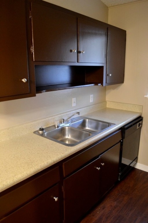 a kitchen with a sink and cabinets