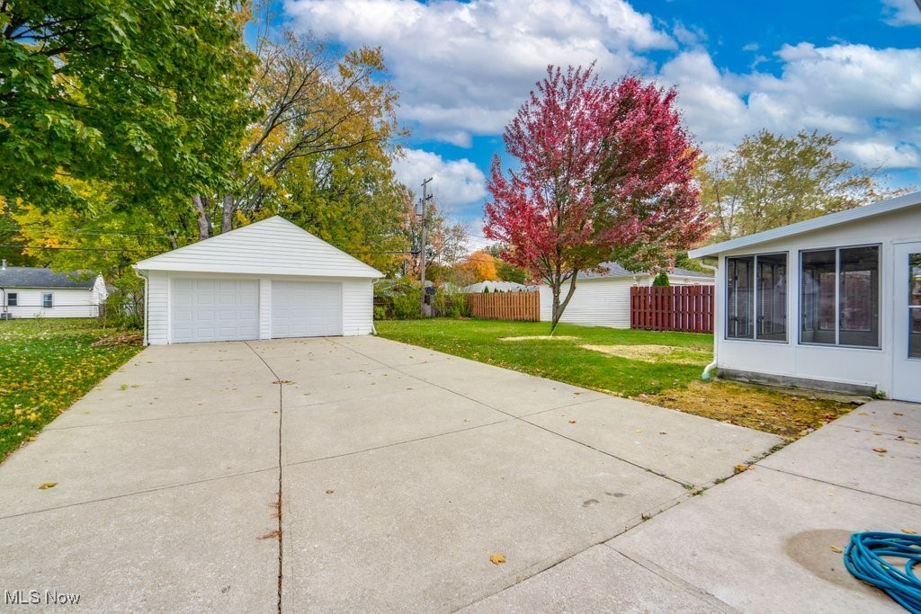 6961 Maplewood Road Parma Heights, OH 44130 - Photo 22 of 22 Garage featuring a yard