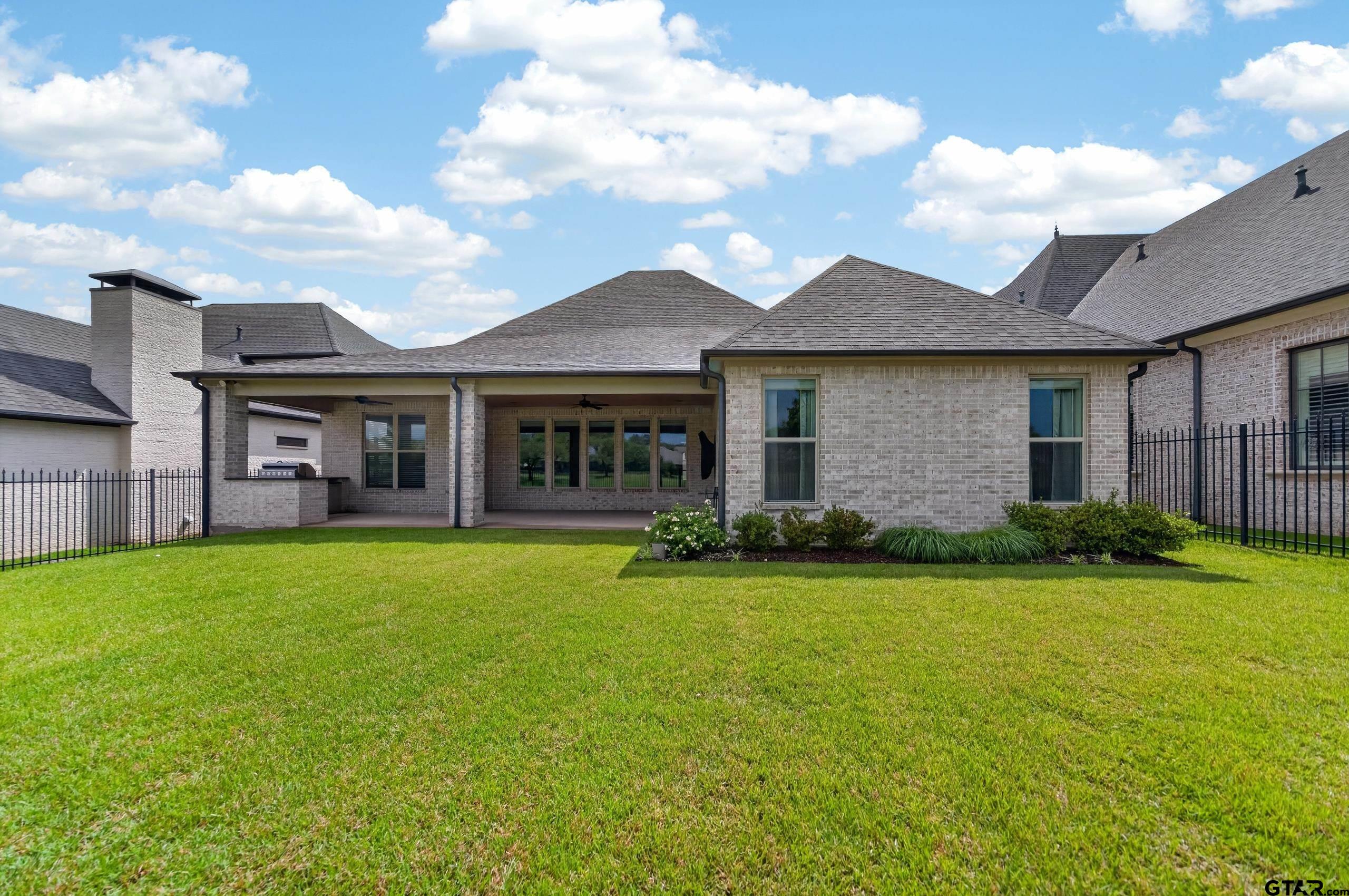 7517 Cross Gate Way Tyler, TX 75703 - Photo 27 of 47 a view of a brick house with a yard