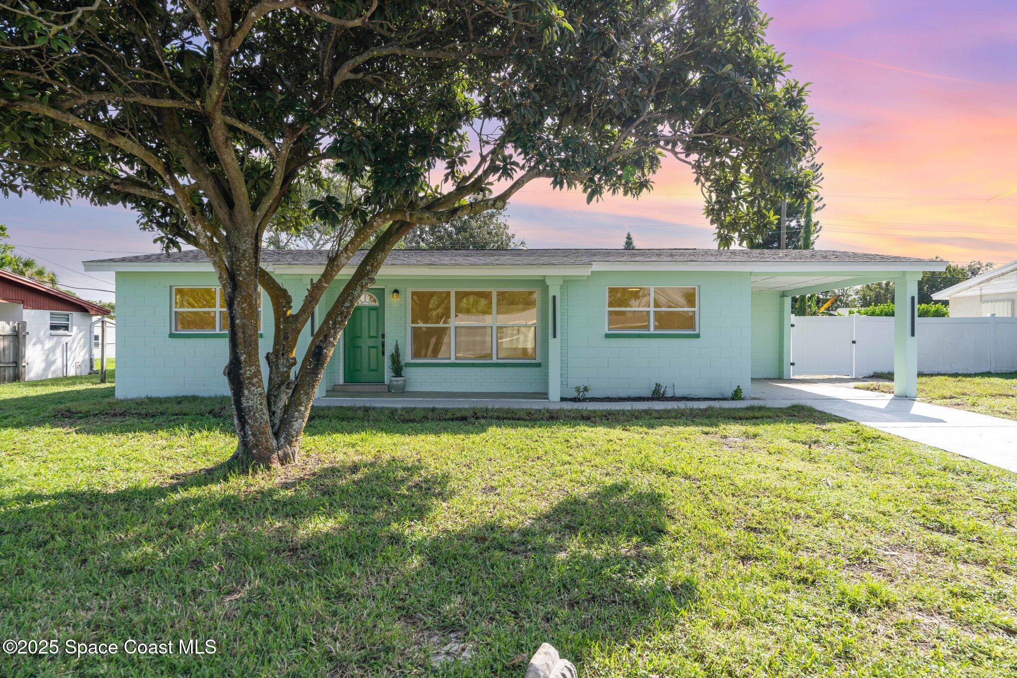 a house with swimming pool in front of it