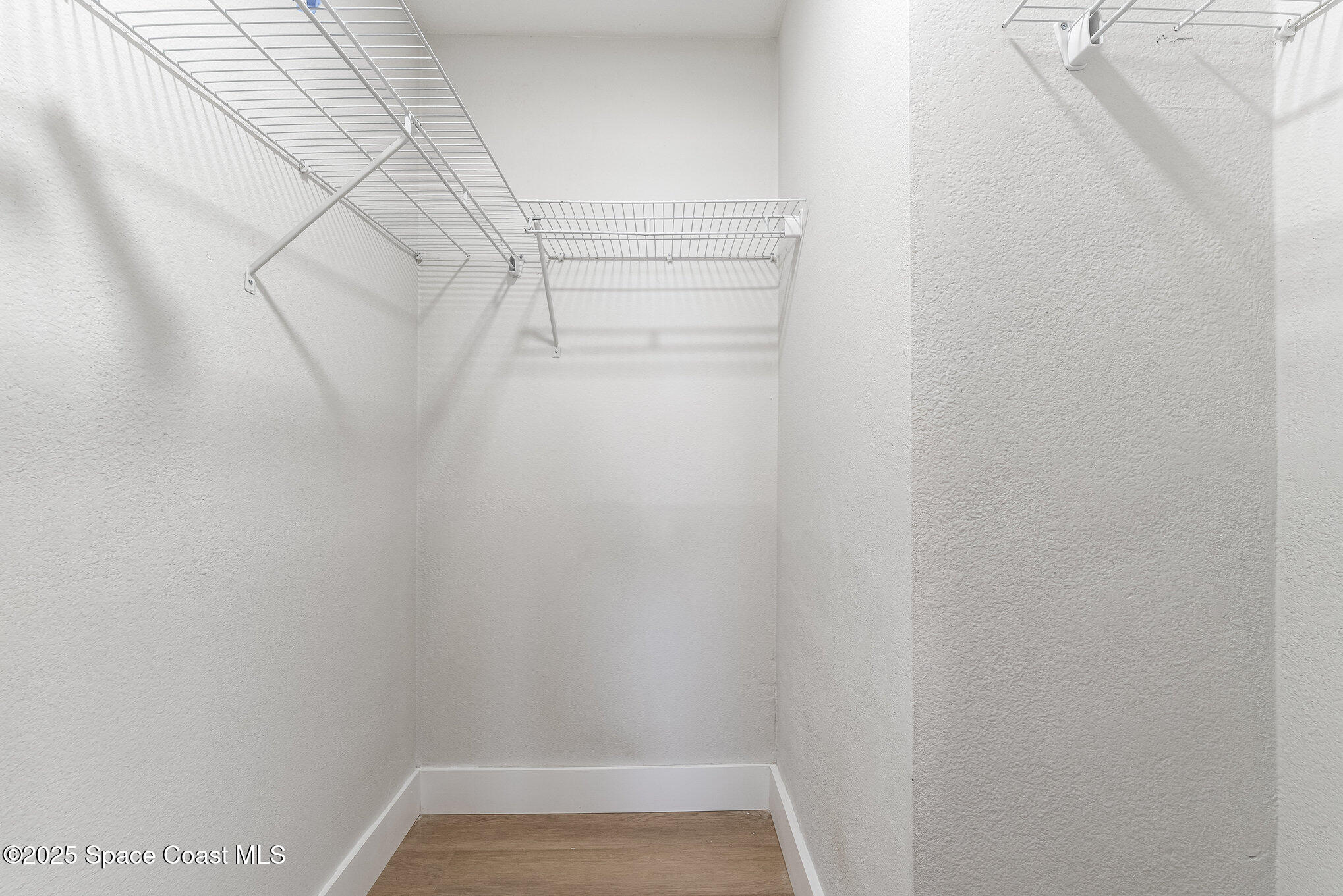 1029 Illinois Road Cocoa, FL 32927 - Photo 14 of 27 a view of a room with racks on the wall