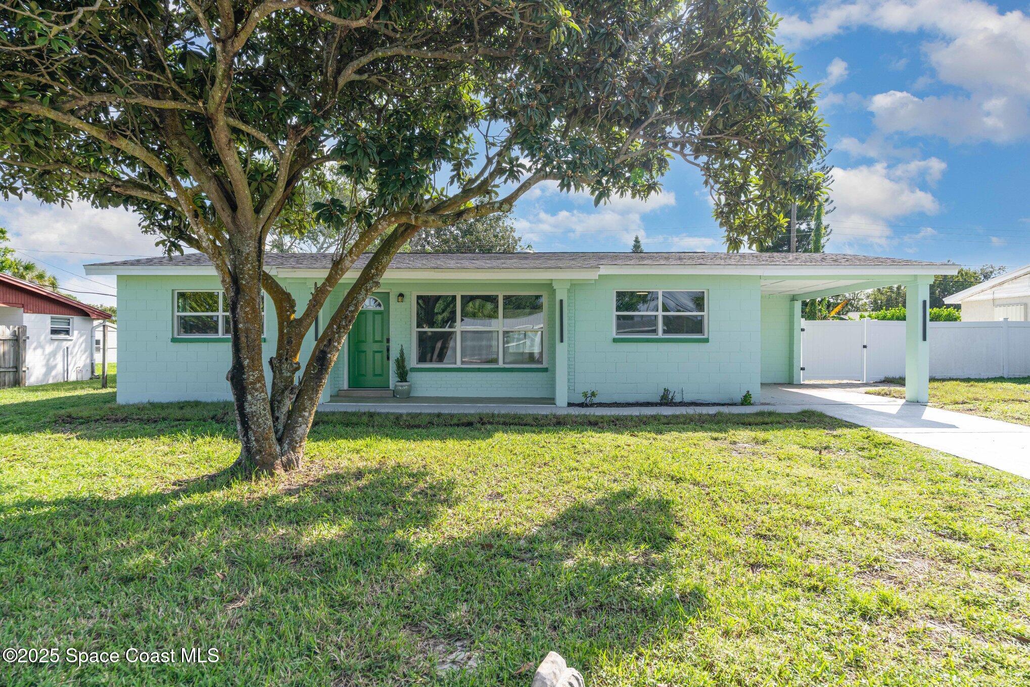 1029 Illinois Road Cocoa, FL 32927 - Photo 2 of 27 a house with swimming pool in front of it