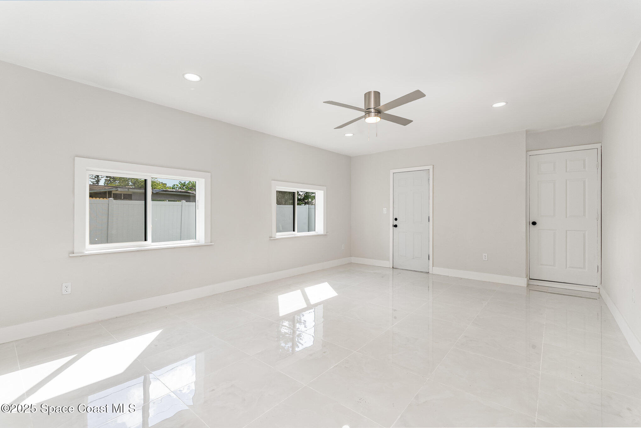 1029 Illinois Road Cocoa, FL 32927 - Photo 21 of 27 a view of an empty room with a window