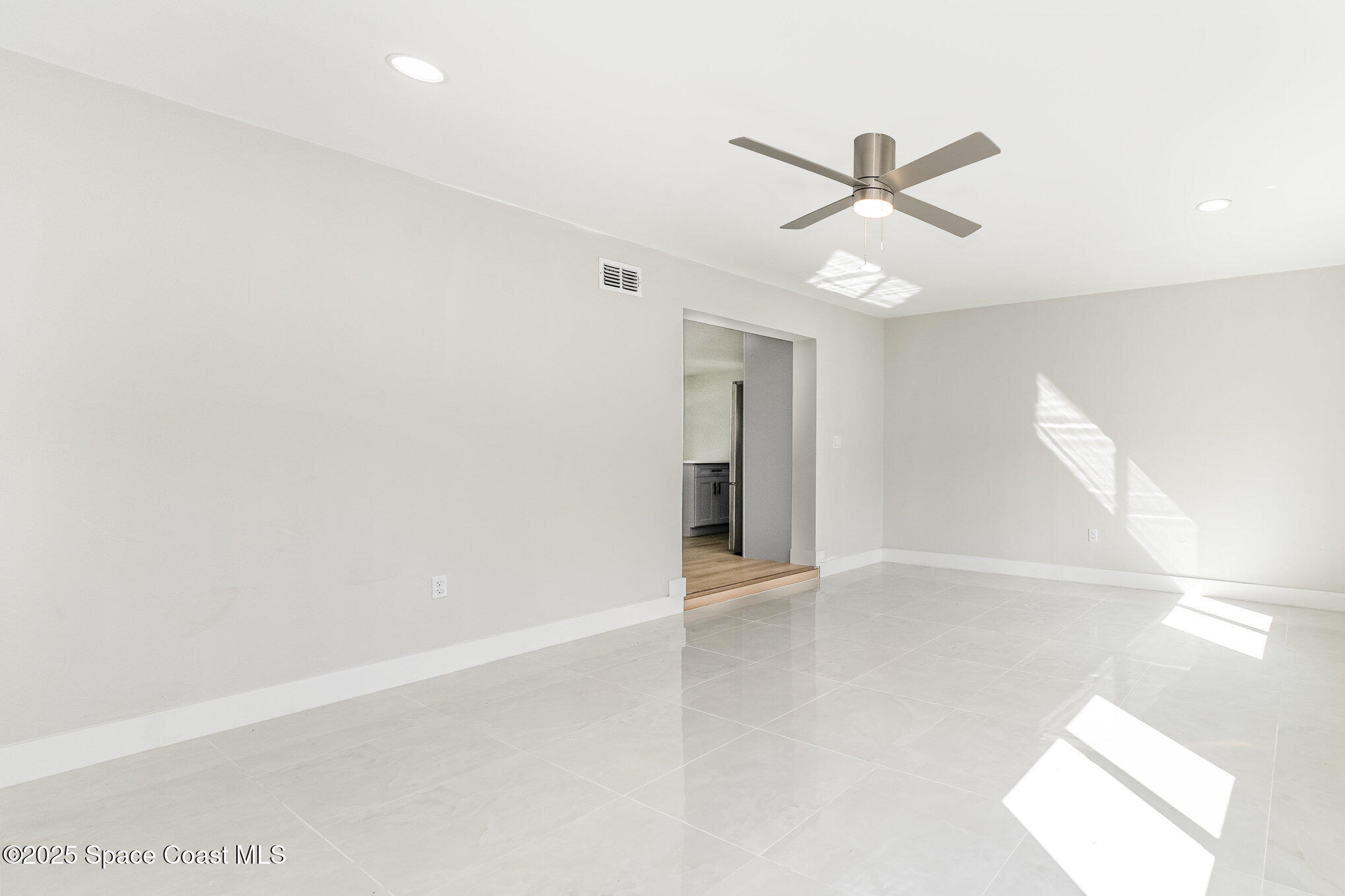 1029 Illinois Road Cocoa, FL 32927 - Photo 23 of 27 a view of an empty room with a window