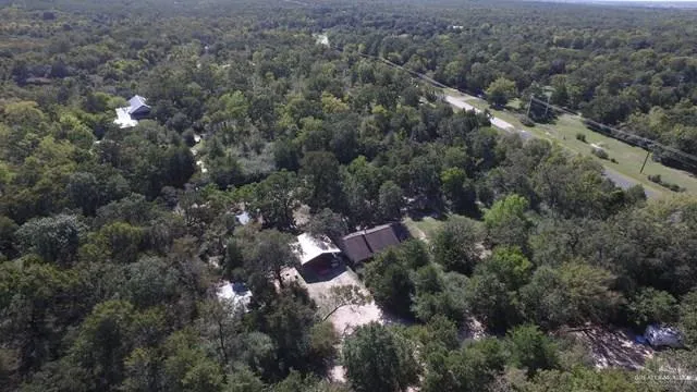an aerial view of residential house with outdoor space