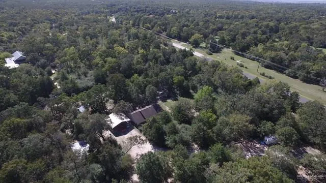 an aerial view of a house with a lake view