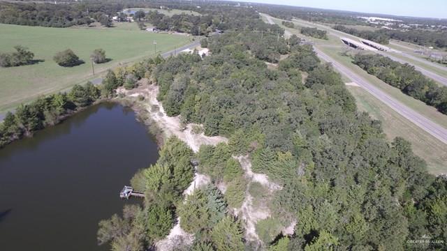 7075 Jones Road Bryan, TX 77807 - Photo 30 of 36 a view of a lake with a yard and mountain view
